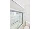 Bright bathroom featuring marble tiling and a glass-enclosed shower at 11137 Acme Dr # 207A, Orlando, FL 32825