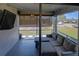 Cozy screened patio with comfortable seating and string lights at 11137 Acme Dr # 207A, Orlando, FL 32825