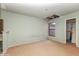 Bedroom featuring carpet flooring, a window, and an exposed section of the ceiling at 12102 Sandal Creek Way, Orlando, FL 32824