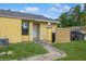 Charming single-story home with a welcoming entrance, complemented by a well-kept lawn and driveway at 12102 Sandal Creek Way, Orlando, FL 32824
