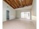Spacious living room featuring tile flooring and large sliding glass doors to the outside area at 12102 Sandal Creek Way, Orlando, FL 32824