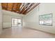 Bright, spacious living room with open beamed ceiling, large slider door, ready for renovation at 12102 Sandal Creek Way, Orlando, FL 32824