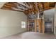 Living room featuring an exposed ceiling, tile flooring, and space to create a kitchen at 12102 Sandal Creek Way, Orlando, FL 32824
