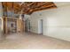 Large living room featuring tile flooring and an exposed ceiling with wooden support beams at 12102 Sandal Creek Way, Orlando, FL 32824