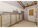 Room ready for renovation with cinder block walls and a door leading outside at 12102 Sandal Creek Way, Orlando, FL 32824
