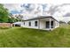 Spacious backyard with a covered patio perfect for outdoor living and entertaining at 13312 Sw 41St Ct, Ocala, FL 34473