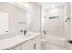 Modern bathroom with a white vanity, bathtub and shower combo with natural light at 13312 Sw 41St Ct, Ocala, FL 34473
