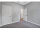 Bedroom with carpeted flooring and a door leading to other rooms at 13312 Sw 41St Ct, Ocala, FL 34473