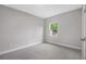 Bright bedroom with neutral carpeting, a freshly painted interior, and bright window at 13312 Sw 41St Ct, Ocala, FL 34473