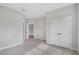 Spacious bedroom with soft carpet and access to a walk-in closet and bathroom at 13312 Sw 41St Ct, Ocala, FL 34473