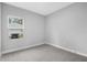 Bedroom features neutral carpeting, fresh paint, and a view from the window at 13312 Sw 41St Ct, Ocala, FL 34473