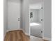 Inviting entryway featuring wood-look floors, fresh paint, and an open doorway at 13312 Sw 41St Ct, Ocala, FL 34473