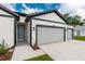 New home with two car garage, eye-catching trim and well maintained landscaping at 13312 Sw 41St Ct, Ocala, FL 34473