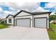 Single Gathering home featuring a spacious two car garage and meticulously manicured lawn at 13312 Sw 41St Ct, Ocala, FL 34473