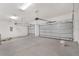 Spacious three car garage with bright lighting and two overhead doors at 13312 Sw 41St Ct, Ocala, FL 34473