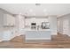 Modern kitchen featuring white cabinets, stainless steel appliances, and island at 13312 Sw 41St Ct, Ocala, FL 34473