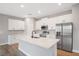 Modern kitchen featuring white cabinets, stainless steel appliances, and island at 13312 Sw 41St Ct, Ocala, FL 34473