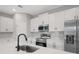 Modern kitchen island with stainless steel appliances at 13312 Sw 41St Ct, Ocala, FL 34473