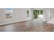Open living space with large windows and sliding glass doors to covered lanai at 13312 Sw 41St Ct, Ocala, FL 34473