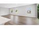 Bright living room featuring three windows and sliding glass door to outdoor space at 13312 Sw 41St Ct, Ocala, FL 34473