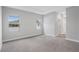 Spacious main bedroom featuring tray ceiling and two windows at 13312 Sw 41St Ct, Ocala, FL 34473