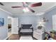 Comfortable Bedroom painted in soft blues, featuring a crib and glider at 1333 Villa Ln # 47, Apopka, FL 32712