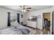 Bedroom featuring a ceiling fan and large window, offering a bright and airy feel at 1333 Villa Ln # 47, Apopka, FL 32712