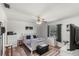 Bright bedroom with wood-look floors and large window providing lots of natural light at 1333 Villa Ln # 47, Apopka, FL 32712