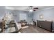 Wide angle view of the Bedroom, featuring a crib, changing table, and glider at 1333 Villa Ln # 47, Apopka, FL 32712
