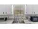 Bright kitchen with granite countertops, stainless steel sink, and updated features at 1333 Villa Ln # 47, Apopka, FL 32712