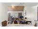 Inviting living room featuring wood plank ceiling, ceiling fan, and sliders to let the outside in at 1333 Villa Ln # 47, Apopka, FL 32712