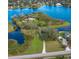 Stunning aerial view of a secluded waterfront property with lush landscaping on a private island at 13377 Lake Butler Blvd, Winter Garden, FL 34787