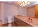 Bathroom with a large mirror, tiled floors, and a pink countertop at 13377 Lake Butler Blvd, Winter Garden, FL 34787