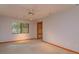 Neutral bedroom featuring a window, fan, and closet at 13377 Lake Butler Blvd, Winter Garden, FL 34787