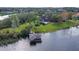 Beautiful lakefront home with a private dock and swimming pool, nestled in a serene, wooded landscape at 13377 Lake Butler Blvd, Winter Garden, FL 34787