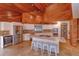 Modern kitchen with stainless steel appliances, a center island with seating, and stone tile flooring at 13377 Lake Butler Blvd, Winter Garden, FL 34787