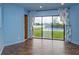 Living room with water view, pool, and access to the backyard at 13377 Lake Butler Blvd, Winter Garden, FL 34787