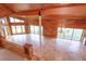 Open living area with travertine floors, a chandelier, and natural light streaming through large windows at 13377 Lake Butler Blvd, Winter Garden, FL 34787