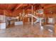 Spacious living room featuring a chandelier, staircase, open kitchen, and travertine floors at 13377 Lake Butler Blvd, Winter Garden, FL 34787