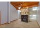 Living room boasting a stone fireplace, wood ceiling, and skylights at 13377 Lake Butler Blvd, Winter Garden, FL 34787