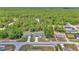 Aerial view of the home among lush greenery and neighboring residences in its community at 13430 Sw 88Th Ter, Ocala, FL 34473