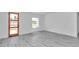 Bright bedroom with hardwood floors, neutral paint and a sunny window facing the front yard at 13430 Sw 88Th Ter, Ocala, FL 34473