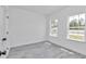 Bright bedroom with hardwood floors, trim, and two new windows at 13430 Sw 88Th Ter, Ocala, FL 34473