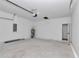 Open garage with a newly installed garage door motor and electrical panels at 13430 Sw 88Th Ter, Ocala, FL 34473