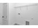 Bright white laundry room featuring shelving for storage and new fixtures at 13430 Sw 88Th Ter, Ocala, FL 34473