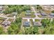 Aerial view of a neighborhood showcasing the home's placement among trees, other homes, and roads at 13430 Sw 88Th Ter, Ocala, FL 34473