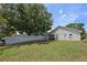 Spacious backyard featuring a well-maintained lawn and a privacy fence, ideal for outdoor activities at 135 Andrews Rd, Sanford, FL 32773