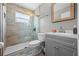 Bathroom featuring a glass shower door, gray cabinetry, and modern finishes at 135 Andrews Rd, Sanford, FL 32773