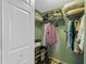 Walk-in closet with wire shelving stocked with clothes, shoes, and storage boxes at 135 Andrews Rd, Sanford, FL 32773