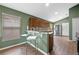 Kitchen with stainless steel appliances, granite counters, and wood laminate floors at 135 Andrews Rd, Sanford, FL 32773